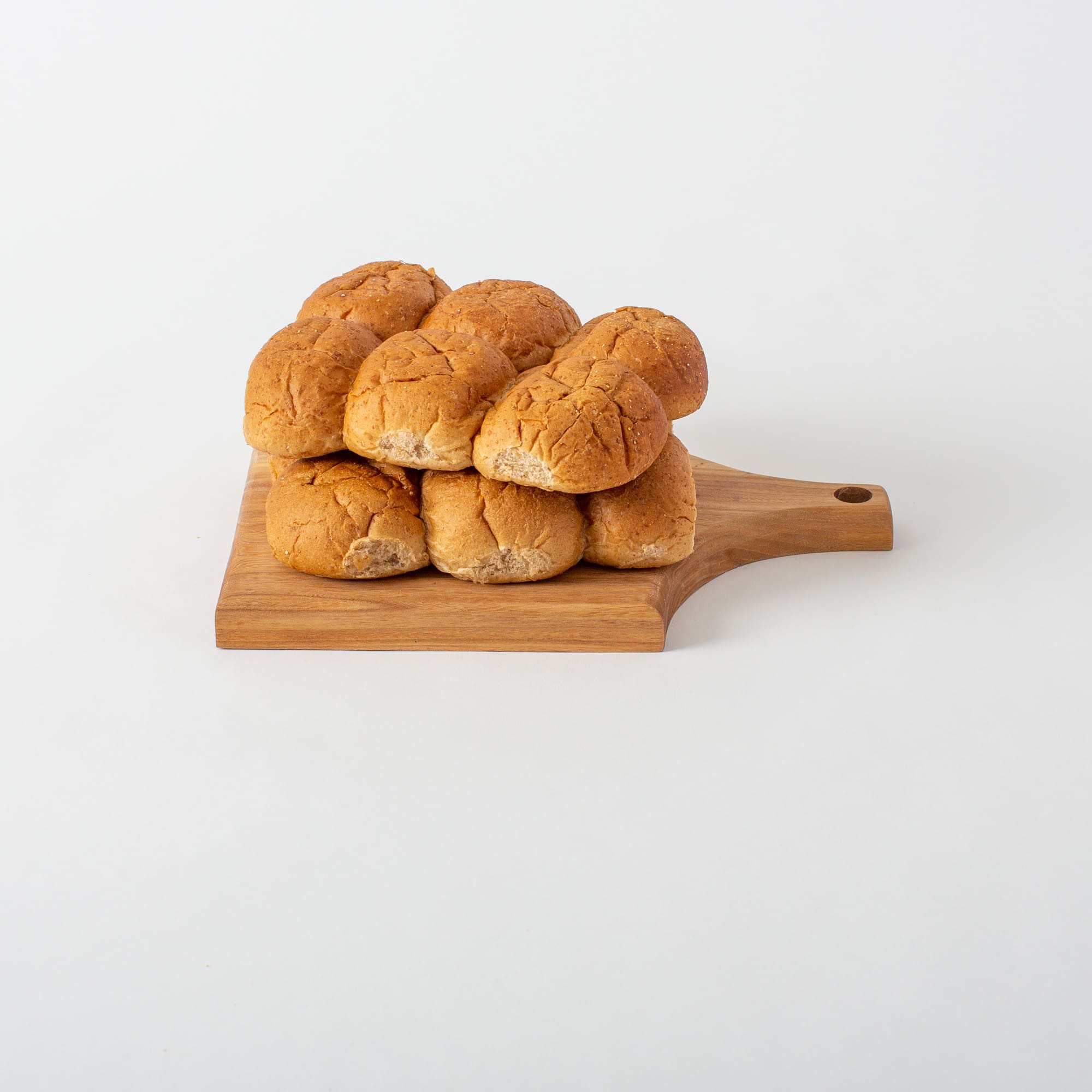 A basket of freshly baked wheat dinner rolls for Thanksgiving.